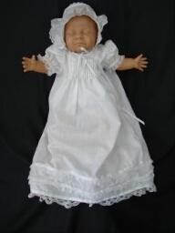 White baby dress and bonnet