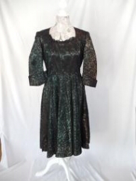 Green dress with black lace