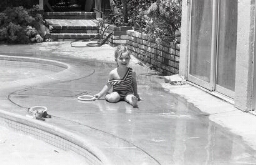 Portrait of young child by the pool