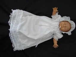 White baby dress and bonnet