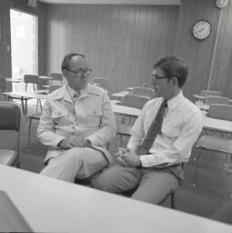 Two men sitting together talking