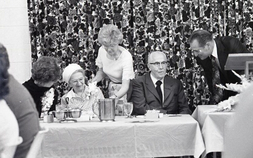 Ezra Taft Benson at a banquet with his wife
