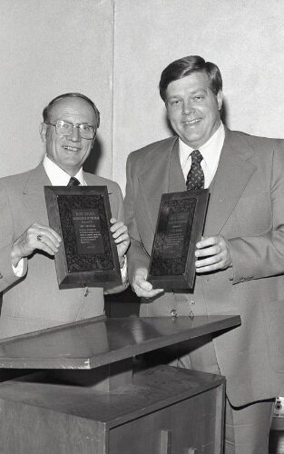 Two men with plaques
